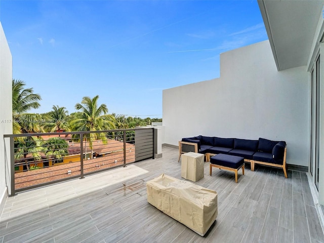 wooden terrace featuring an outdoor living space