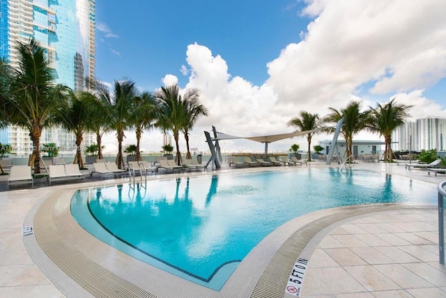 view of swimming pool with a patio area