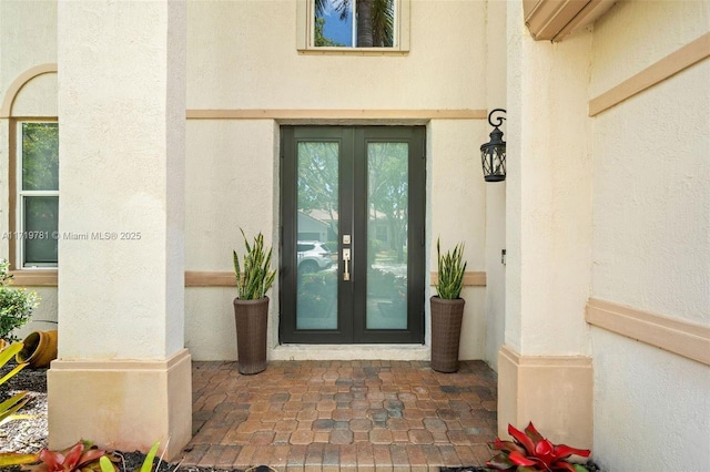 property entrance featuring french doors