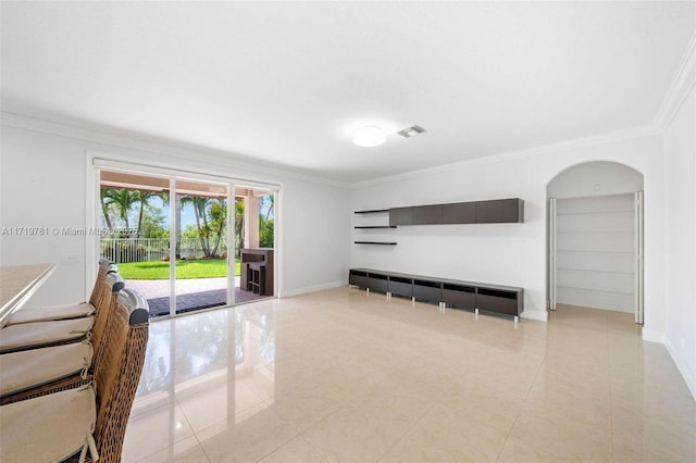 unfurnished living room with crown molding and light tile patterned flooring