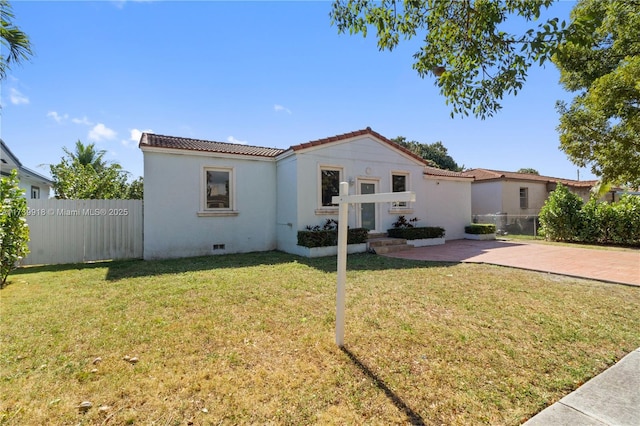 back of house with a lawn