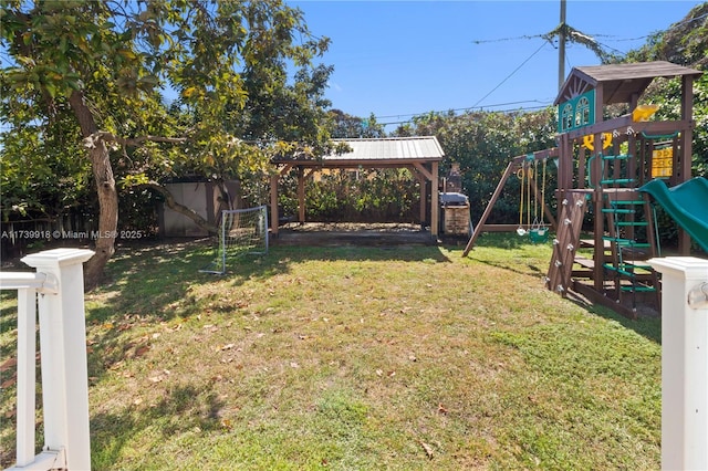 view of yard with a gazebo and a playground