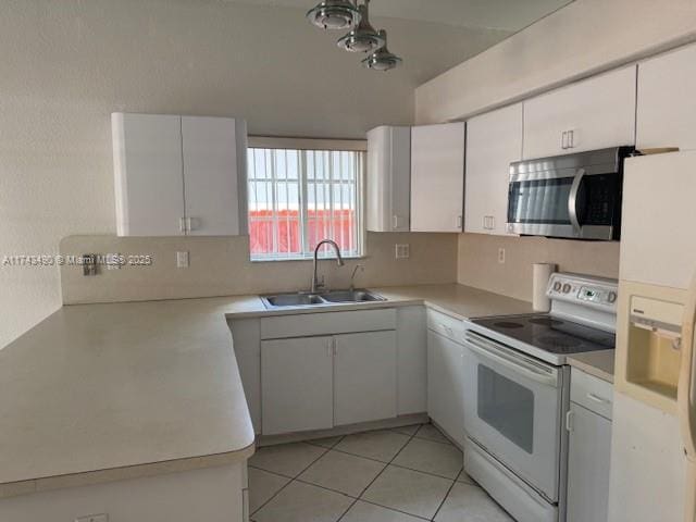 kitchen featuring white cabinetry, white appliances, sink, and light tile patterned floors