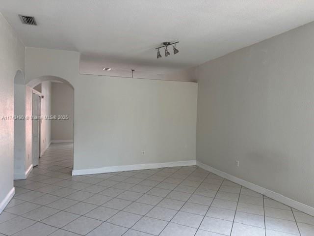 view of tiled spare room