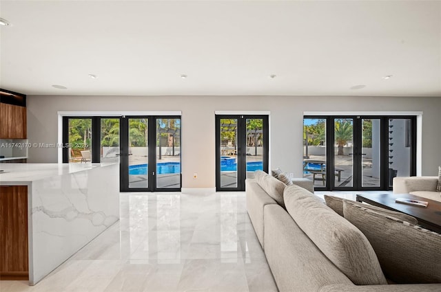 living room with french doors and a wealth of natural light