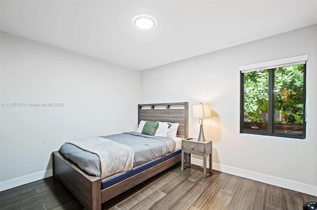 bedroom with wood-type flooring