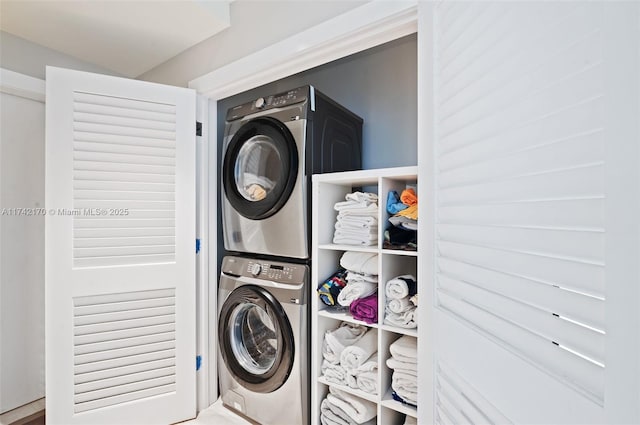 laundry room with stacked washing maching and dryer