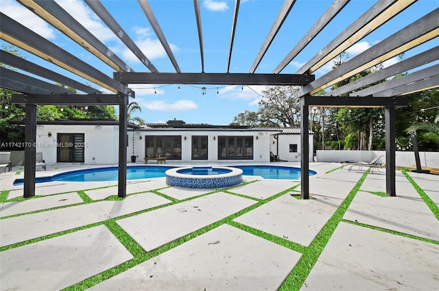 view of pool with an in ground hot tub, a patio, and a pergola