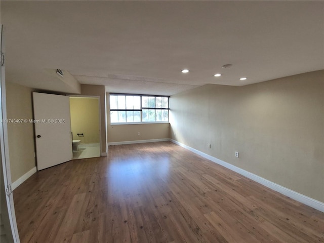 spare room featuring hardwood / wood-style floors