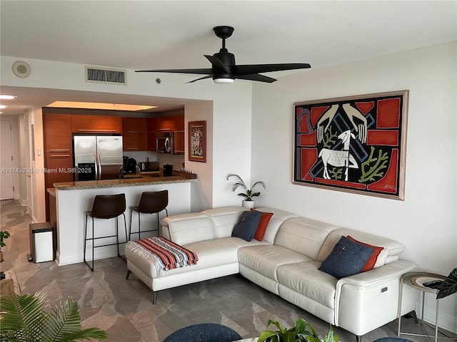 living room with ceiling fan