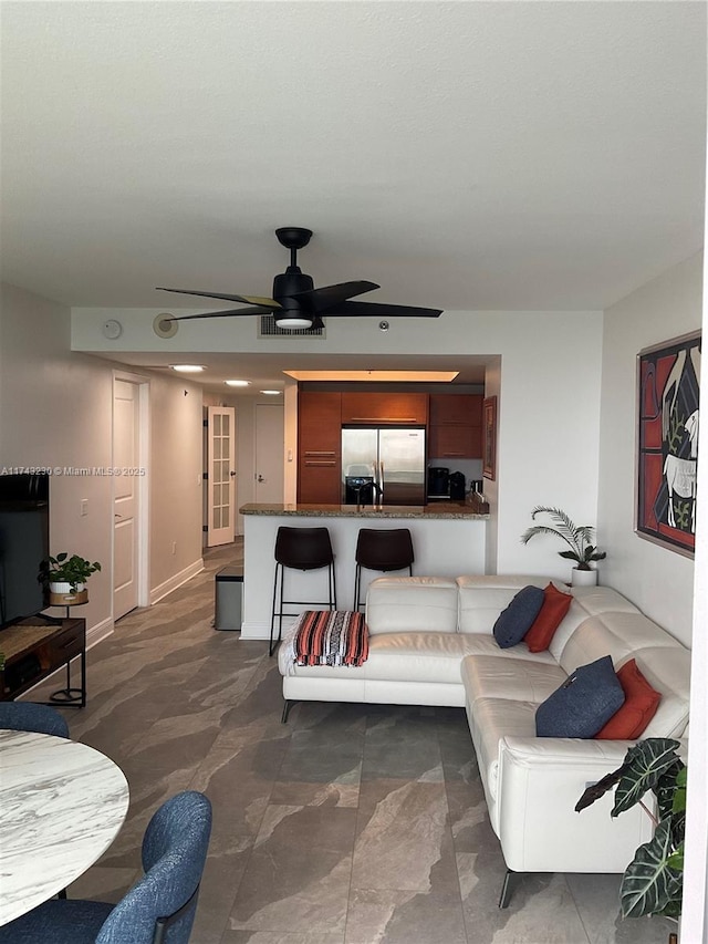 living room featuring ceiling fan