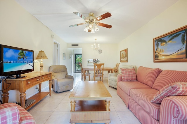 living room with light tile patterned floors and ceiling fan with notable chandelier