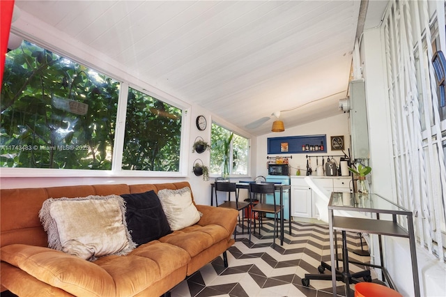 living room featuring vaulted ceiling