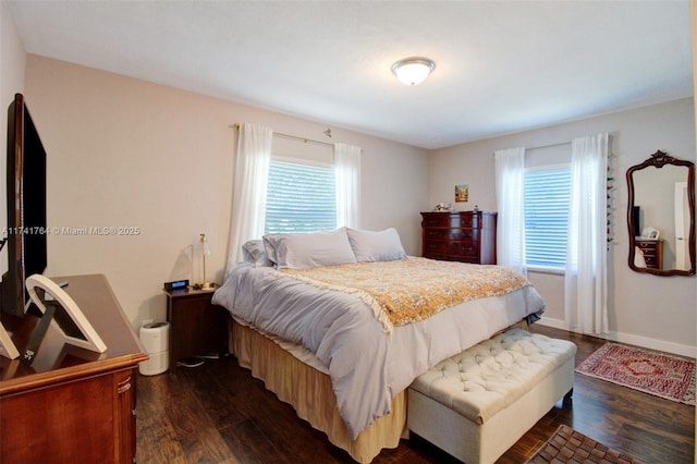 bedroom featuring dark hardwood / wood-style flooring