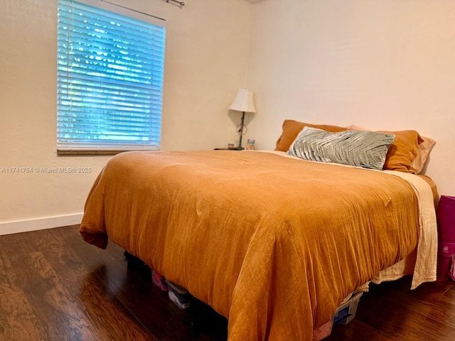 bedroom featuring dark hardwood / wood-style floors