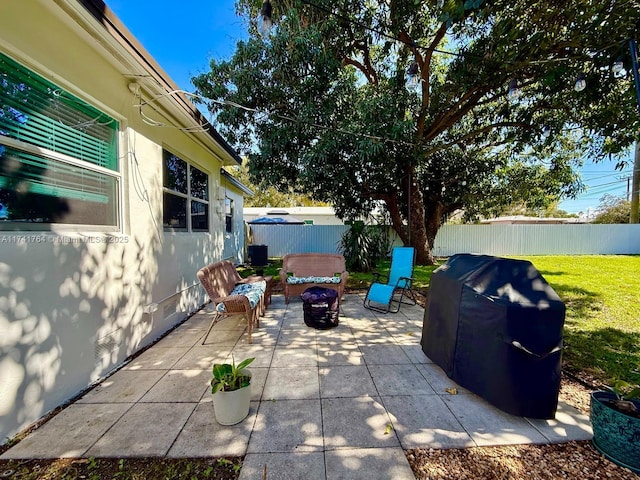 view of patio / terrace with grilling area and a fire pit