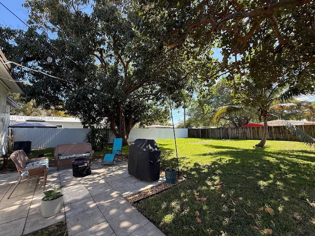 view of yard with cooling unit and a patio area