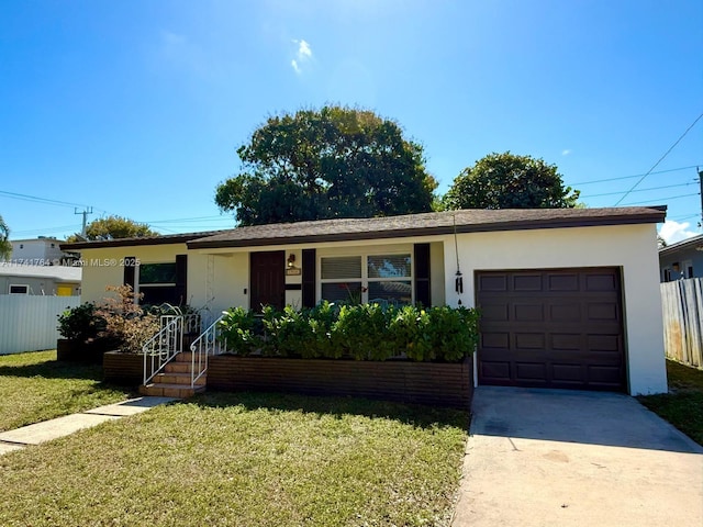 single story home featuring a garage and a front lawn