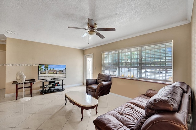 tiled living area with a textured ceiling, visible vents, baseboards, a ceiling fan, and ornamental molding