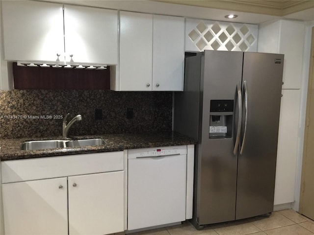 1351 NE Miami Gardens Dr Unit 1403E, Miami, FL 33179 - kitchen featuring sink, stainless steel fridge, white dishwasher, white cabinets, and decorative backsplash