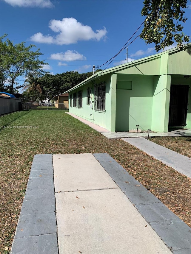 view of home's exterior featuring a yard