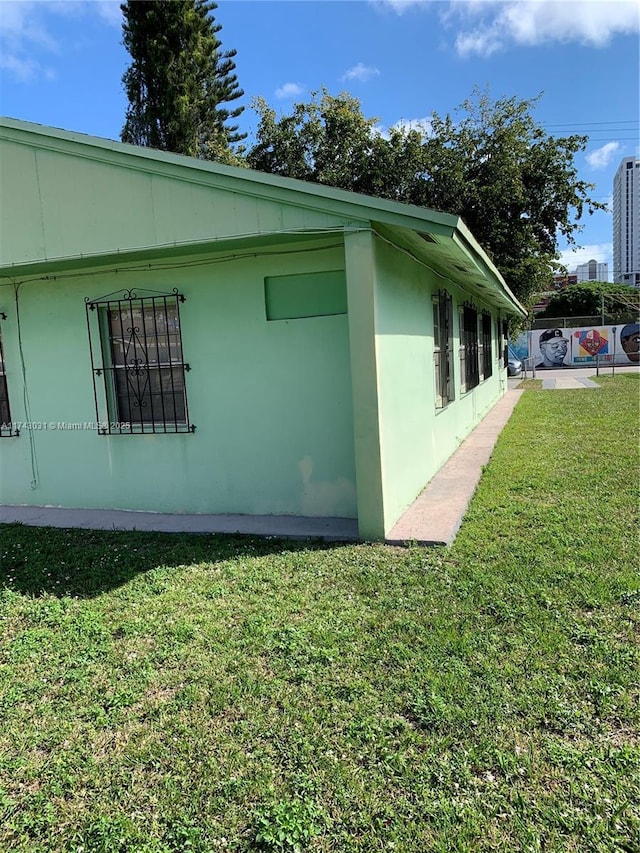 view of home's exterior featuring a yard