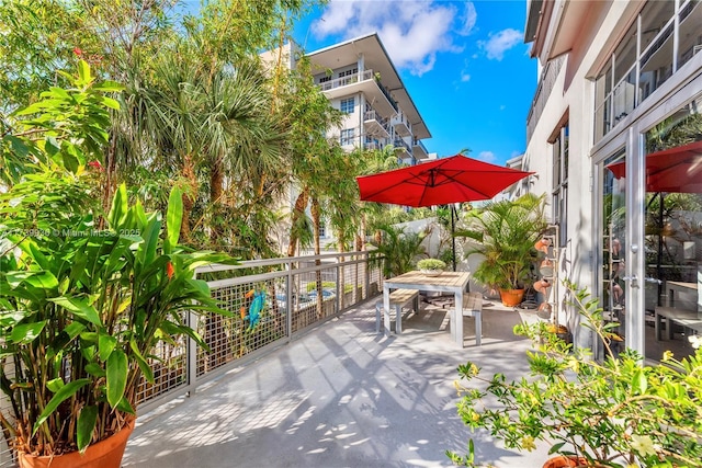 view of patio / terrace with a balcony