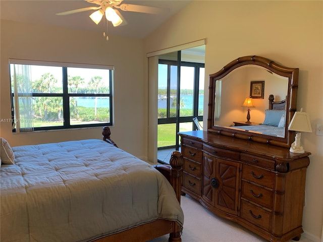 bedroom with lofted ceiling, access to exterior, light colored carpet, and ceiling fan