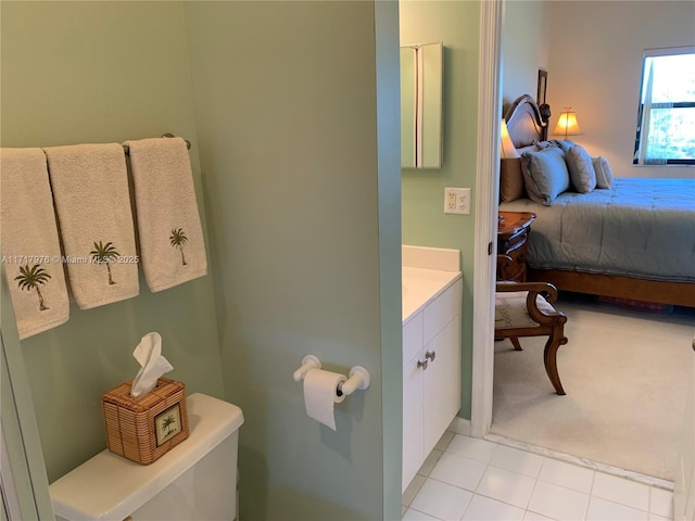 bathroom with vanity, tile patterned floors, and toilet