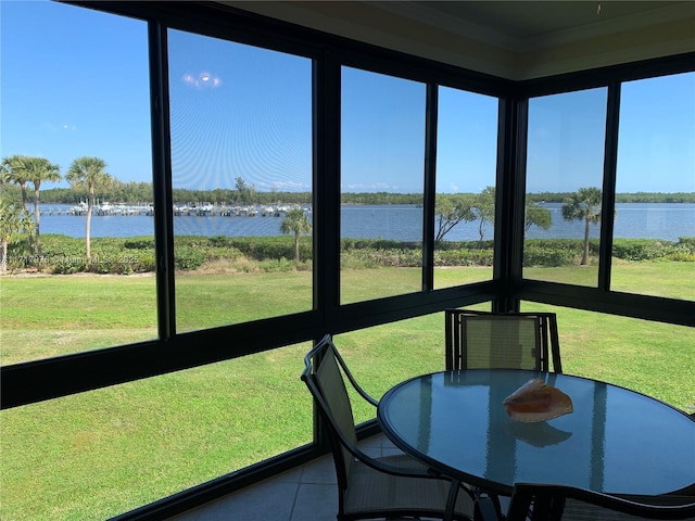 unfurnished sunroom with a water view