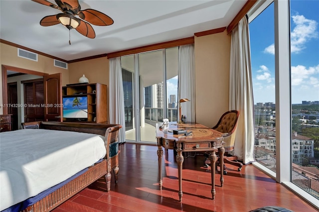bedroom with access to exterior, visible vents, ornamental molding, and wood finished floors