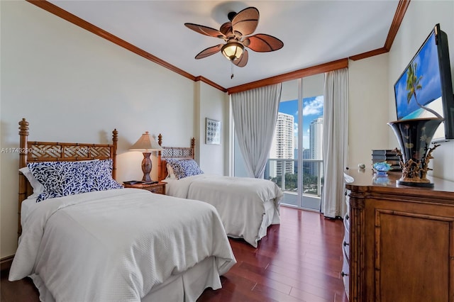 bedroom featuring ornamental molding, dark wood-type flooring, floor to ceiling windows, access to exterior, and ceiling fan
