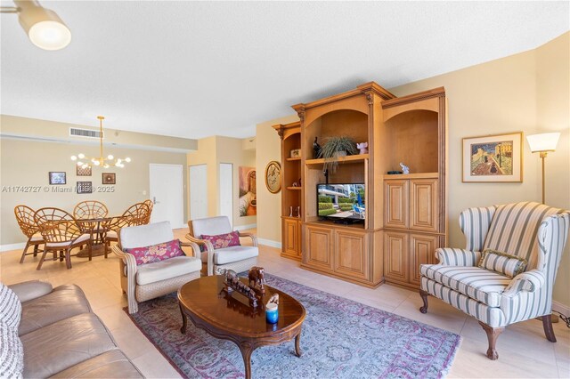 tiled living room with an inviting chandelier