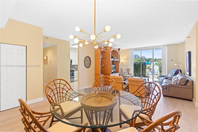 tiled dining room featuring a wall of windows and a chandelier