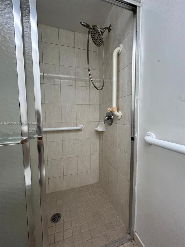 bathroom with tiled shower