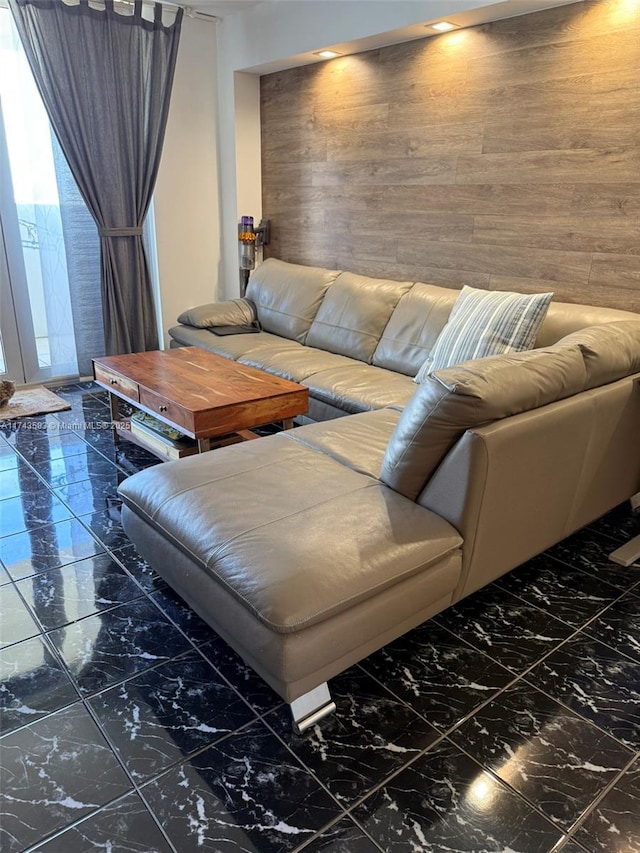 2780 NE 183rd St Unit 2109, Aventura, FL 33160 - living room featuring marble look tiles and wood walls