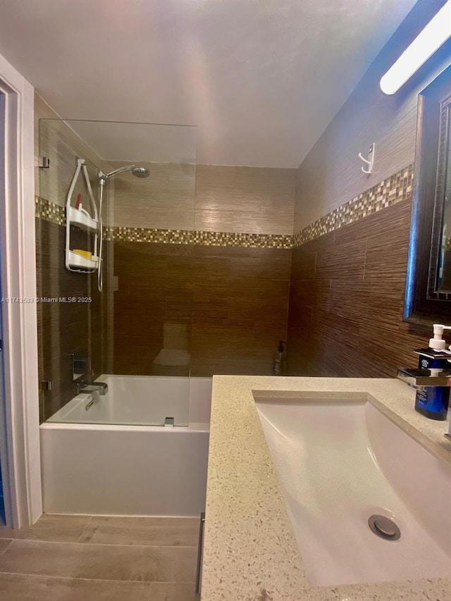 full bath with a sink and bathing tub / shower combination