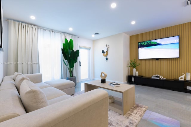 living room featuring wood walls