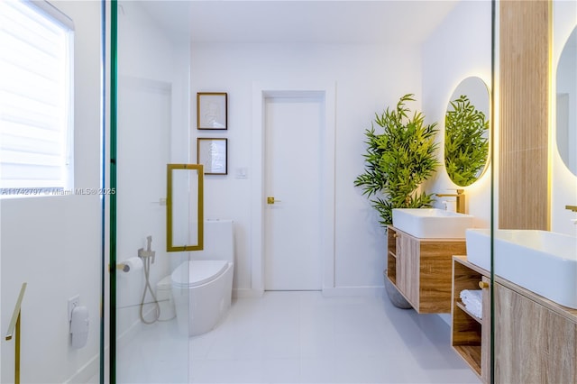 bathroom with vanity, a shower, tile patterned floors, and toilet