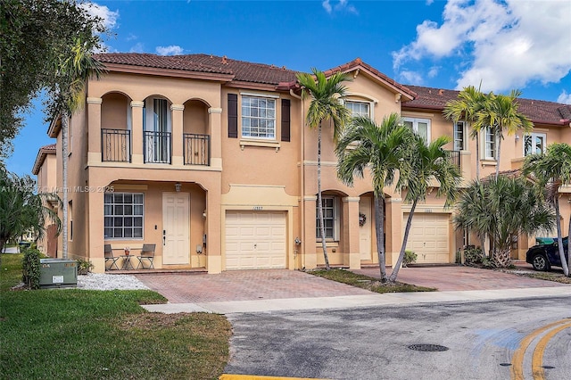 mediterranean / spanish-style home featuring a garage