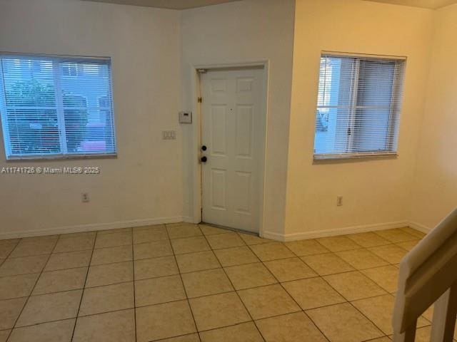 entrance foyer with light tile patterned floors