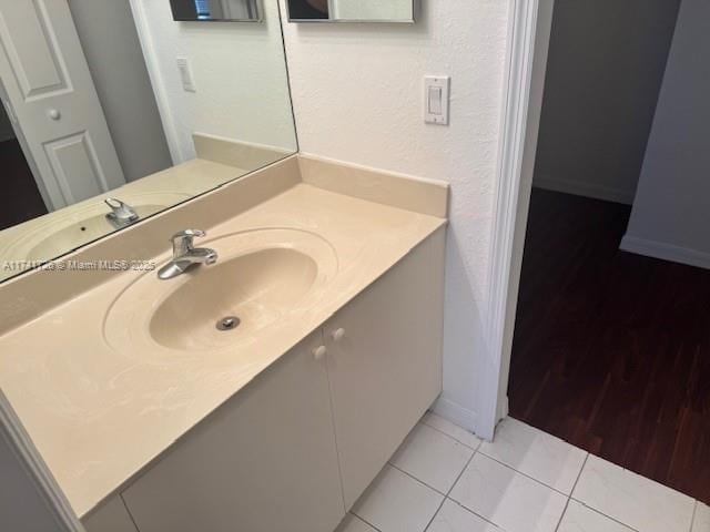 bathroom featuring vanity and tile patterned flooring