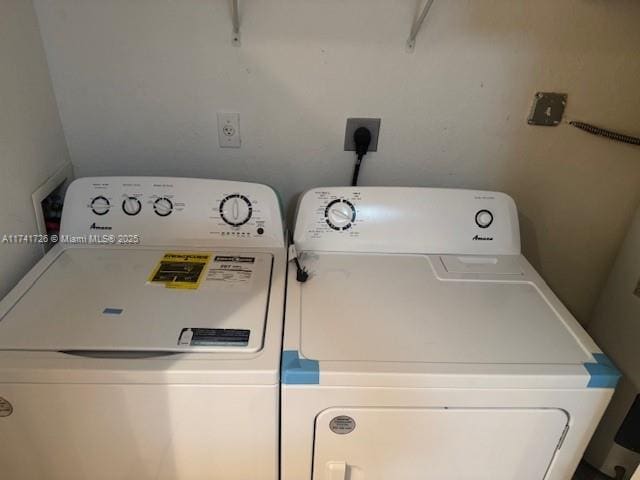 washroom featuring independent washer and dryer