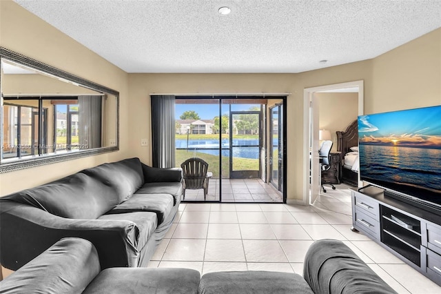 tiled living room with a textured ceiling