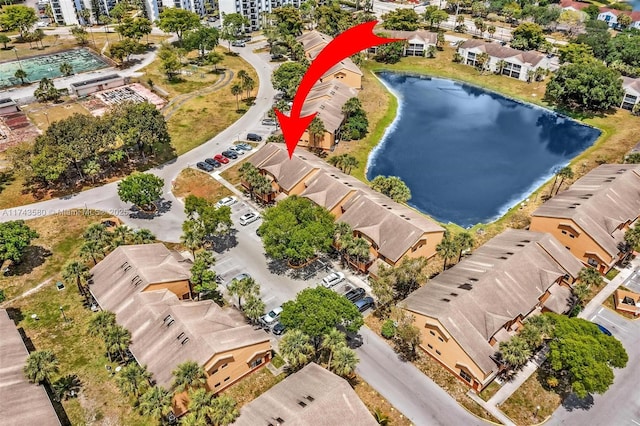 birds eye view of property with a water view