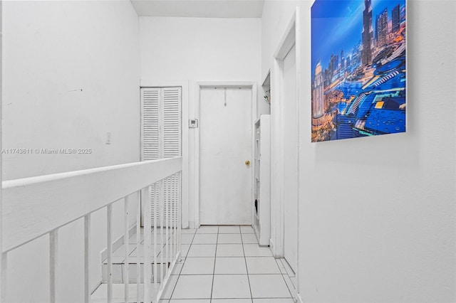 hall with light tile patterned flooring