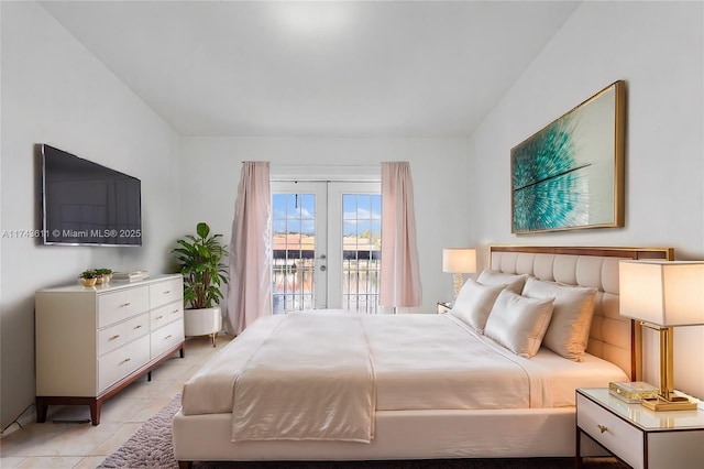 bedroom featuring light tile patterned floors, access to outside, and french doors