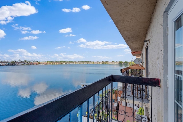 balcony featuring a water view