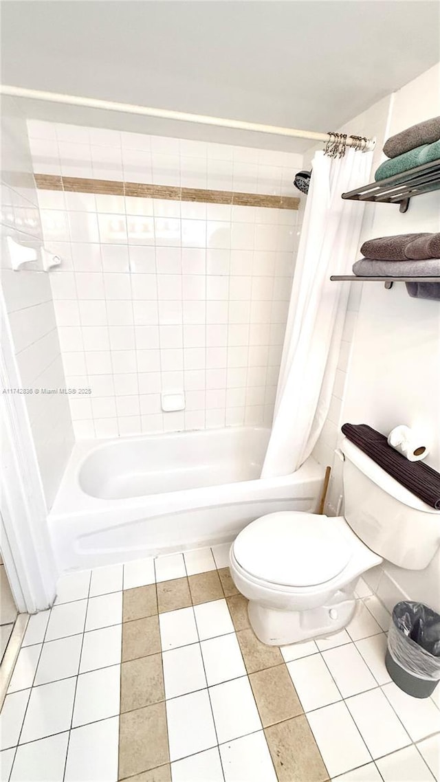 1200 Brickell Bay Dr Unit 2216, Miami, FL 33131 - bathroom with shower / tub combo with curtain and tile patterned floors
