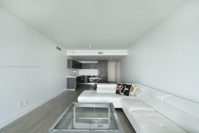 living room with dark wood-type flooring